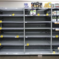 This image of nearly empty shelves of bottled water indicates