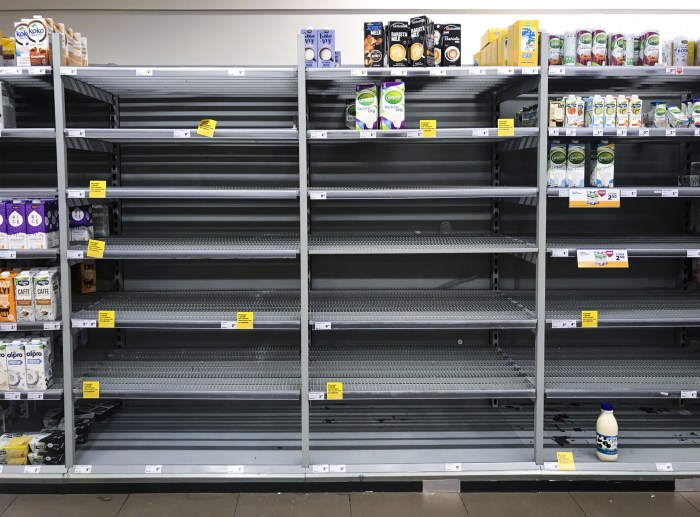 This image of nearly empty shelves of bottled water indicates